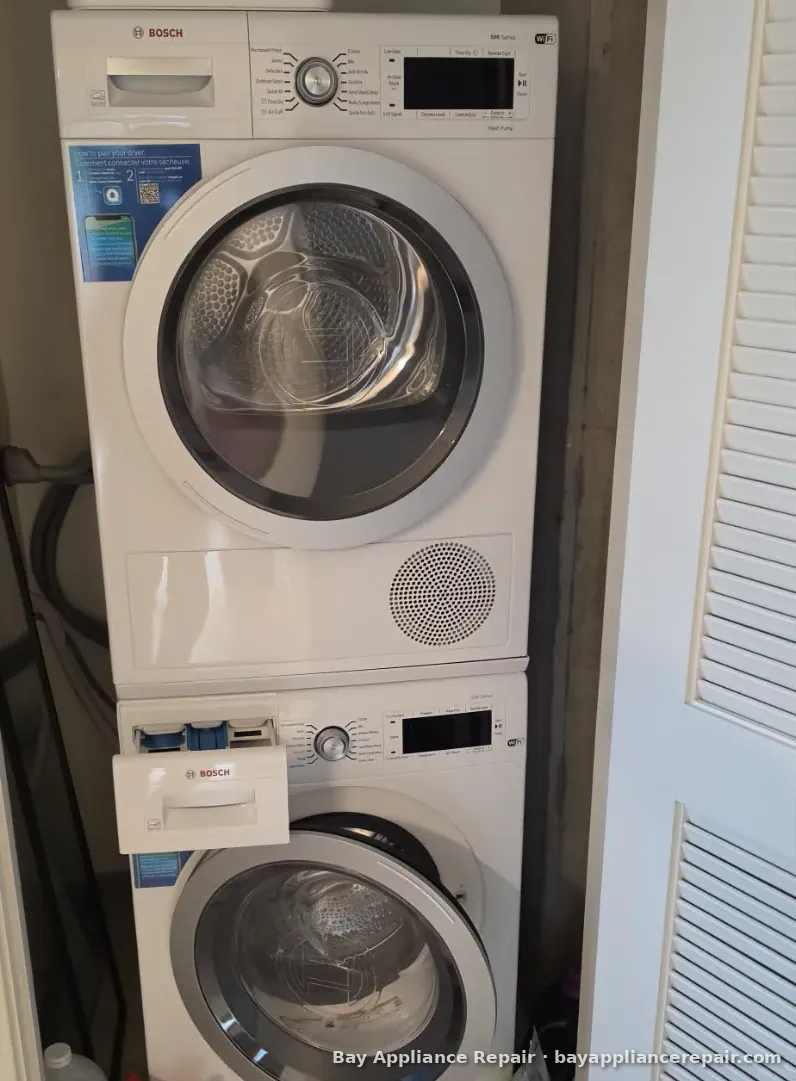 Bosch compact washer and dryer stacked in a laundry closet