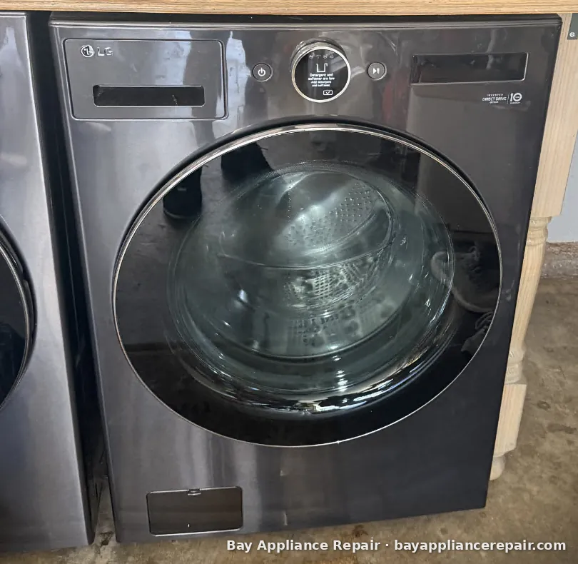 LG front-load washer in a customer's garage during a repair visit